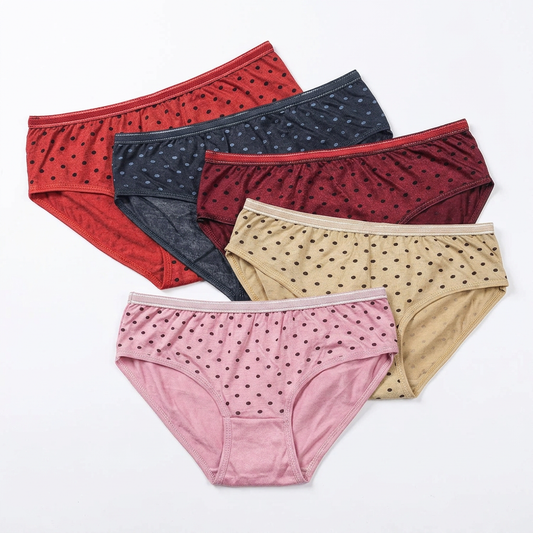Five dotted briefs arranged on a white background